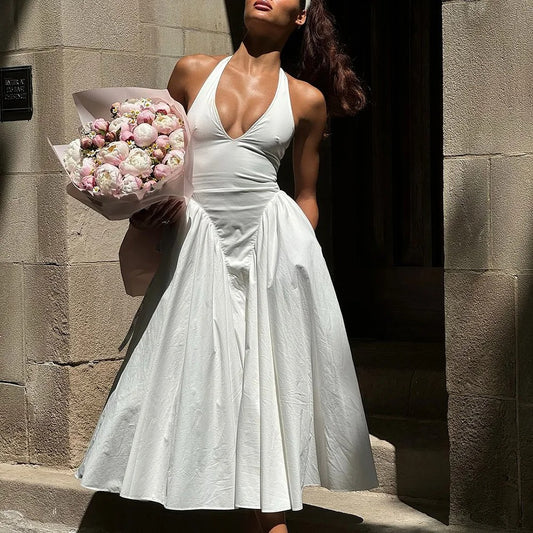 Elegant dress for women with a knotted neckline and a flared skirt